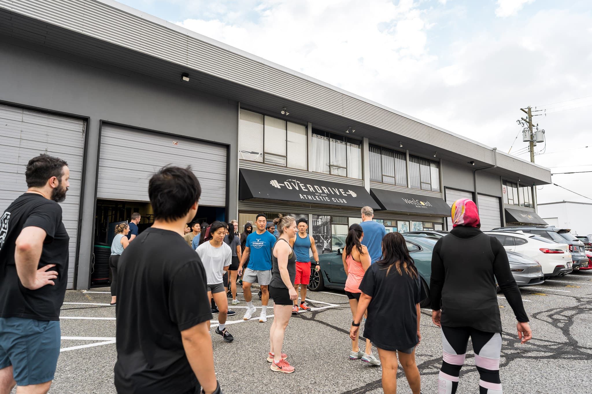 Members gathered outside the Overdrive Athletic Club entrance on Elmbridge Way in Richmond, BC