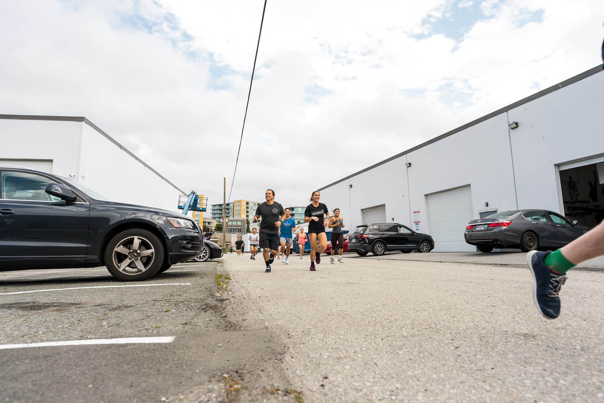 Members running together outside Overdrive Athletic Club in Richmond, BC