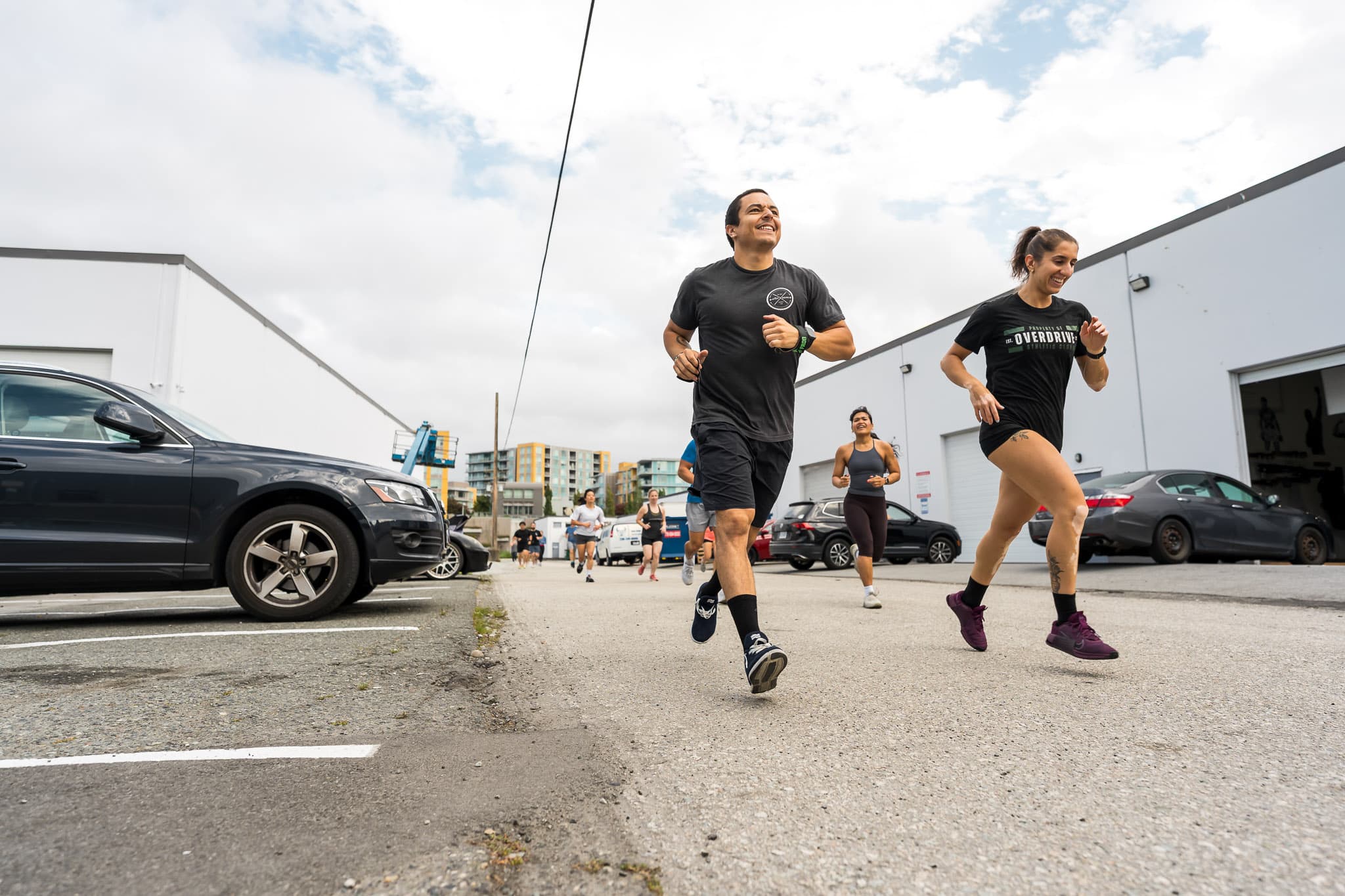 Members running together outside Overdrive Athletic Club in Richmond, BC