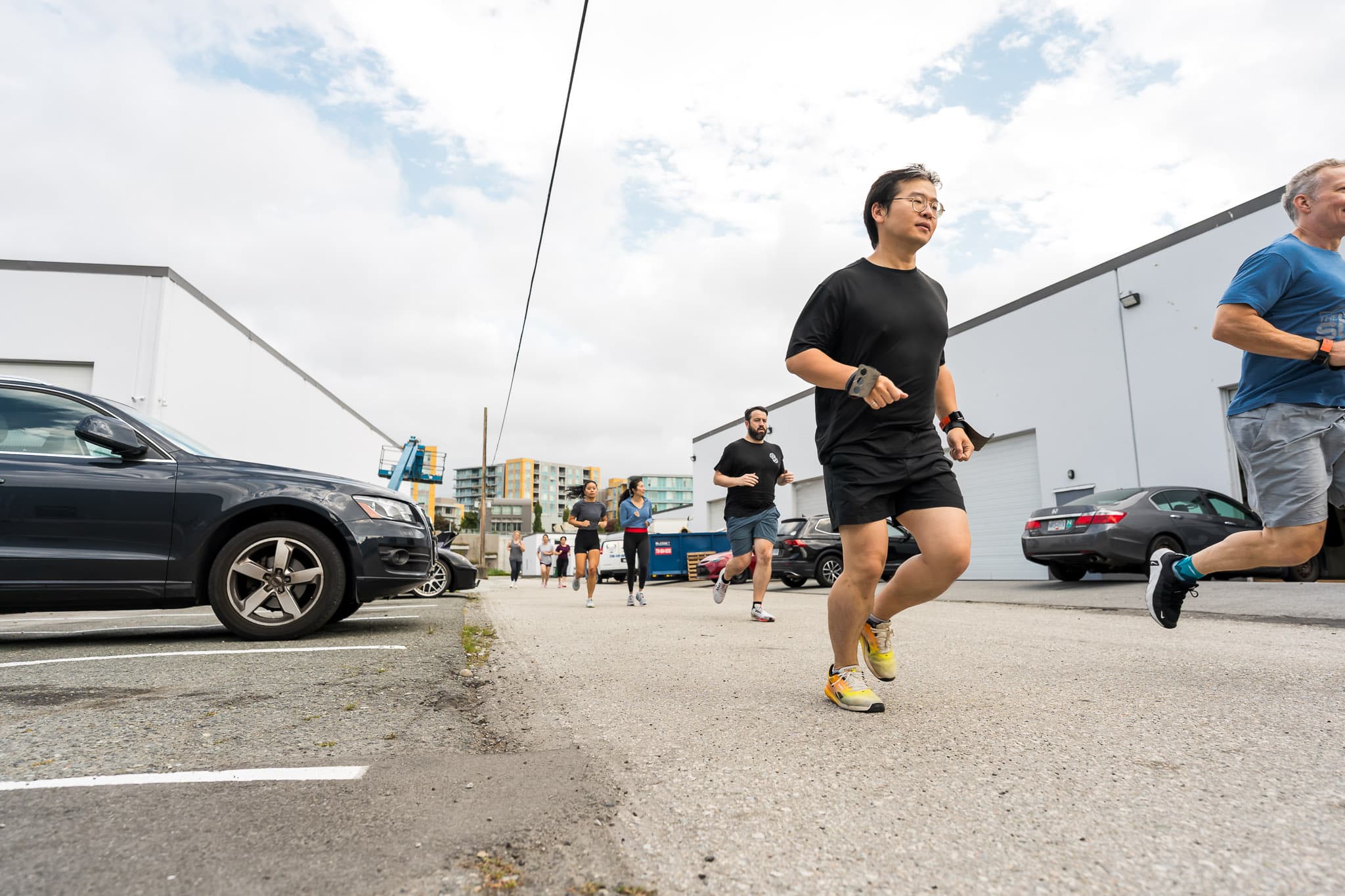 Members running together outside Overdrive Athletic Club in Richmond, BC