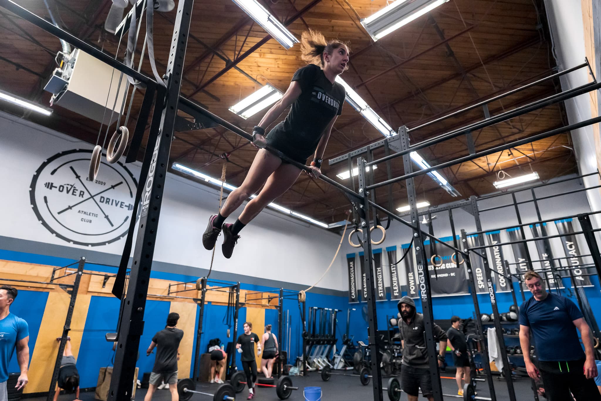 A member performing a pull-up during a CrossFit class at Overdrive Athletic Club in Richmond, BC