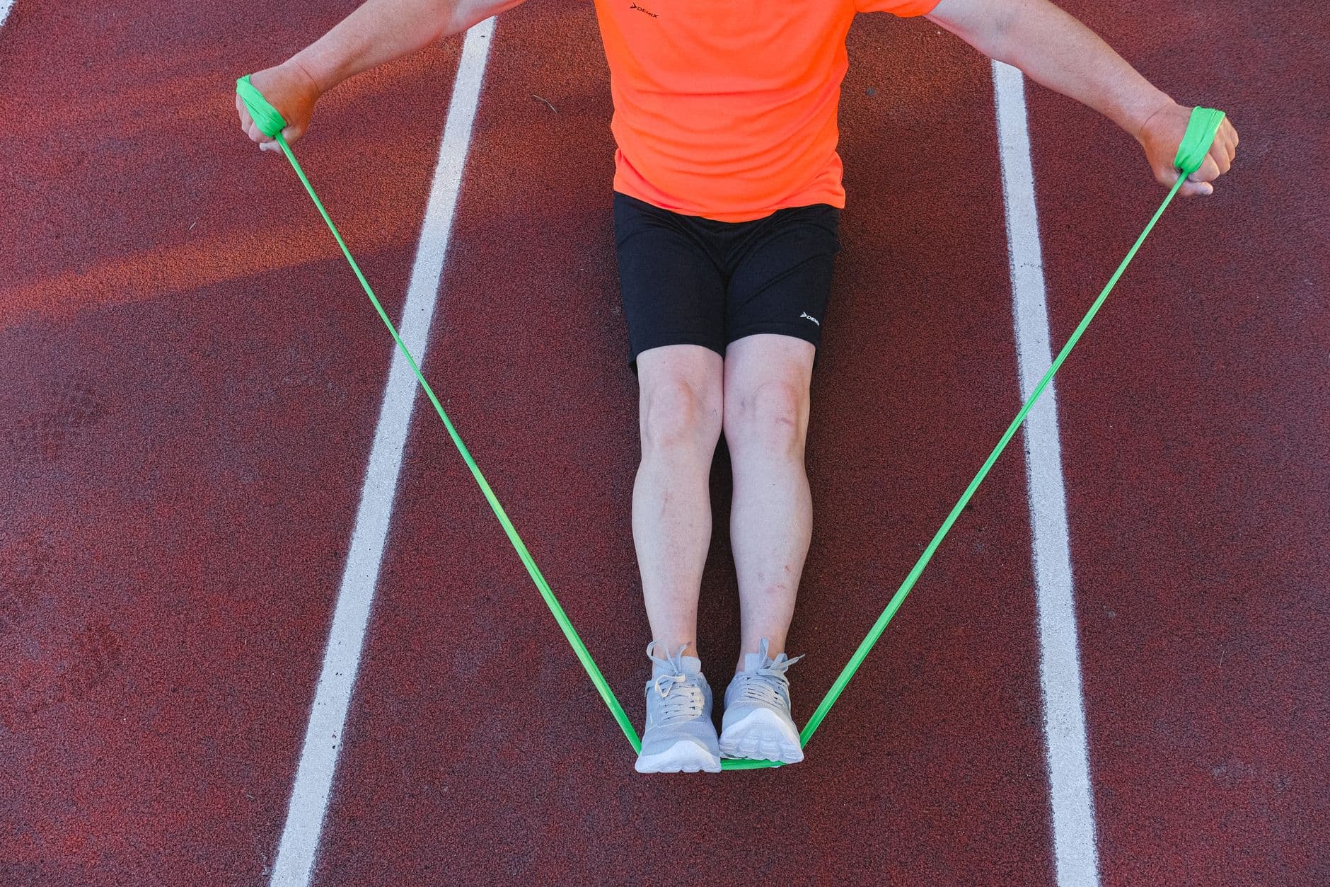 An athlete training with a resistance band during a rehabilitation session